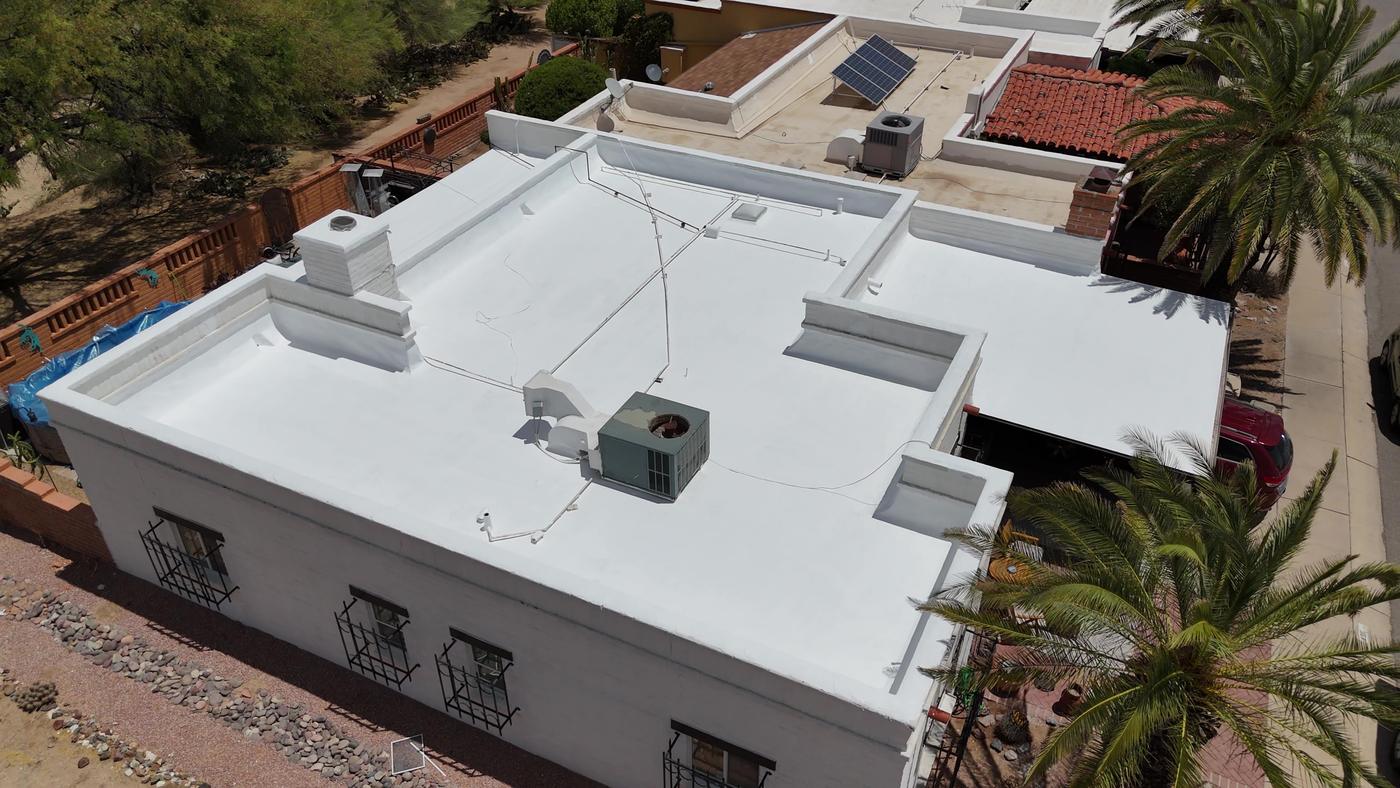 Aerial view of a coated flat roof.