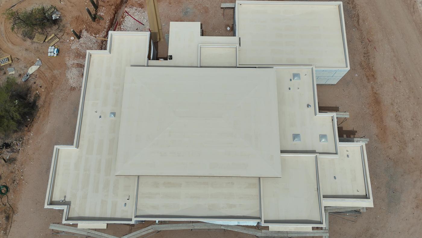 Flat roof installation on a custom home.
