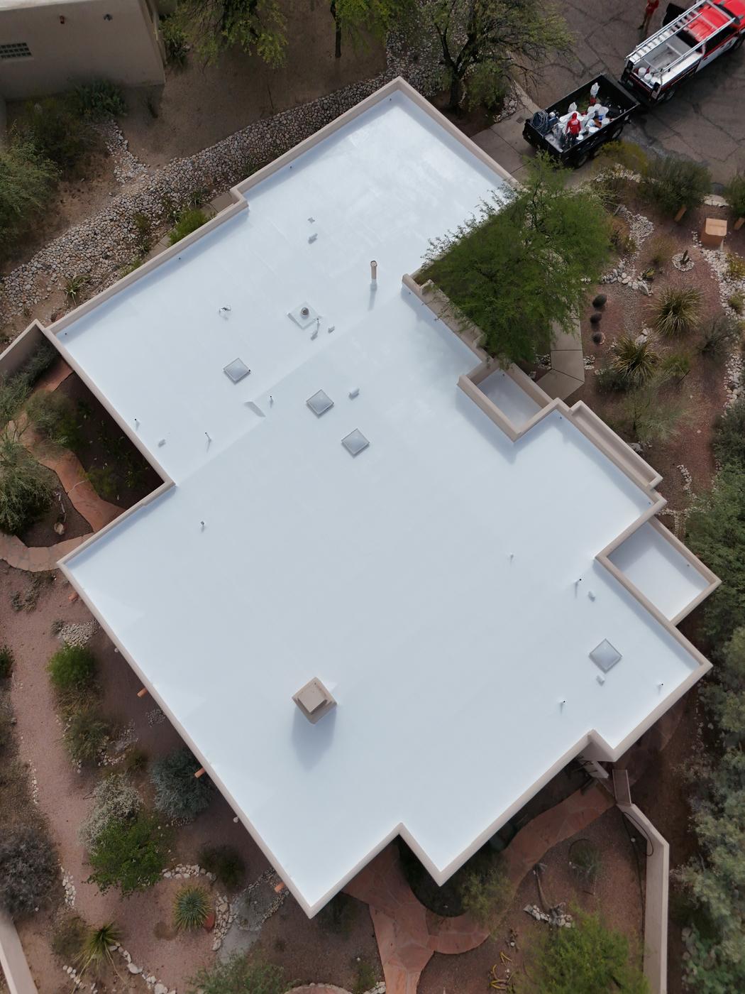 Finished flat roof with a fresh coat of roof coating.