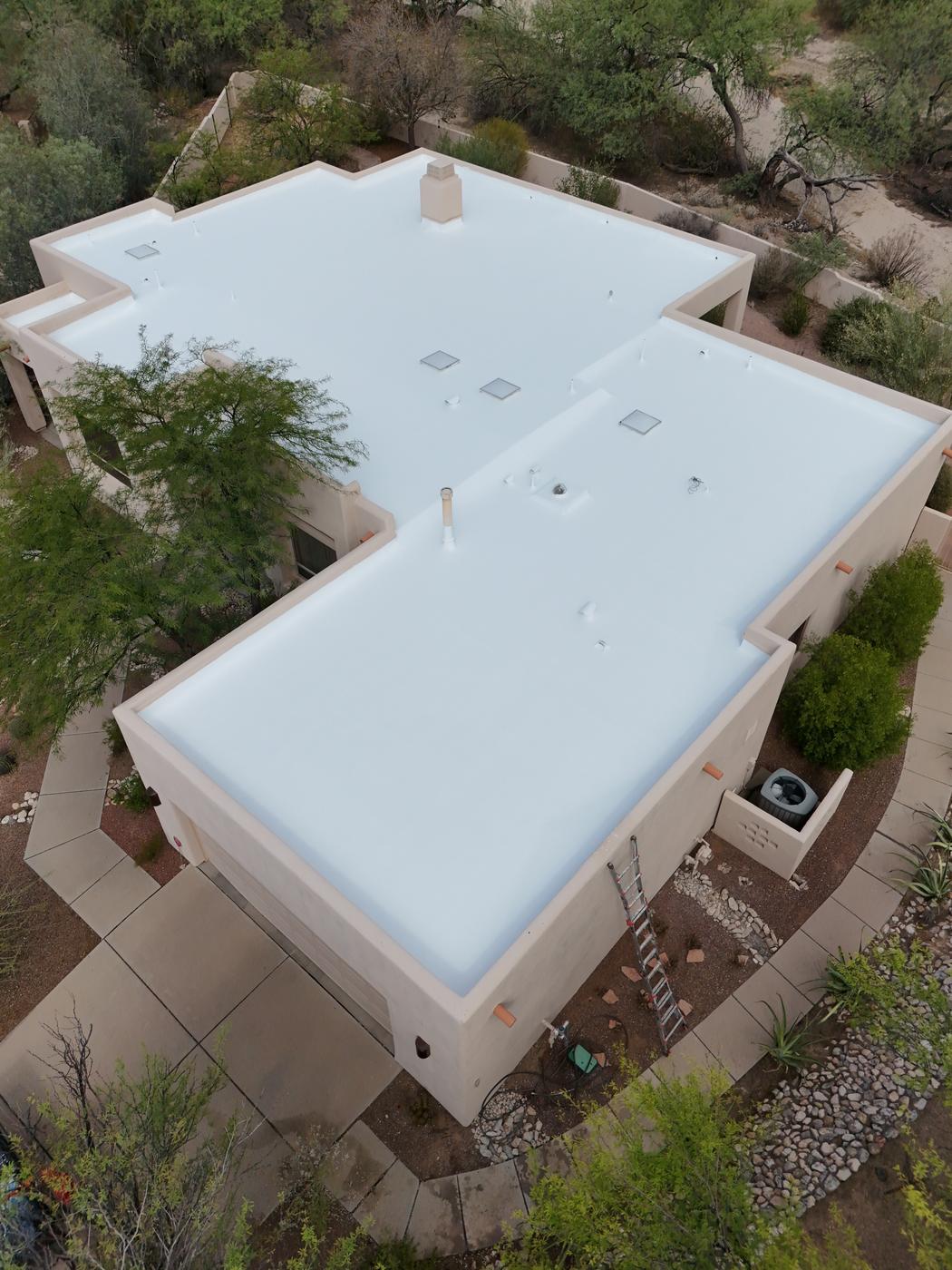 Finished flat roof with a fresh coat of roof coating.