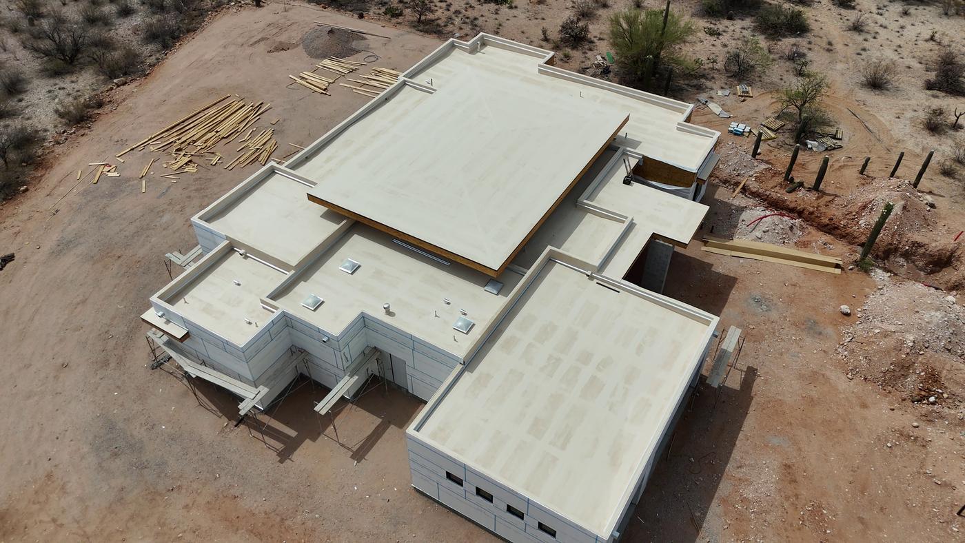 Flat roof installation on a custom home.