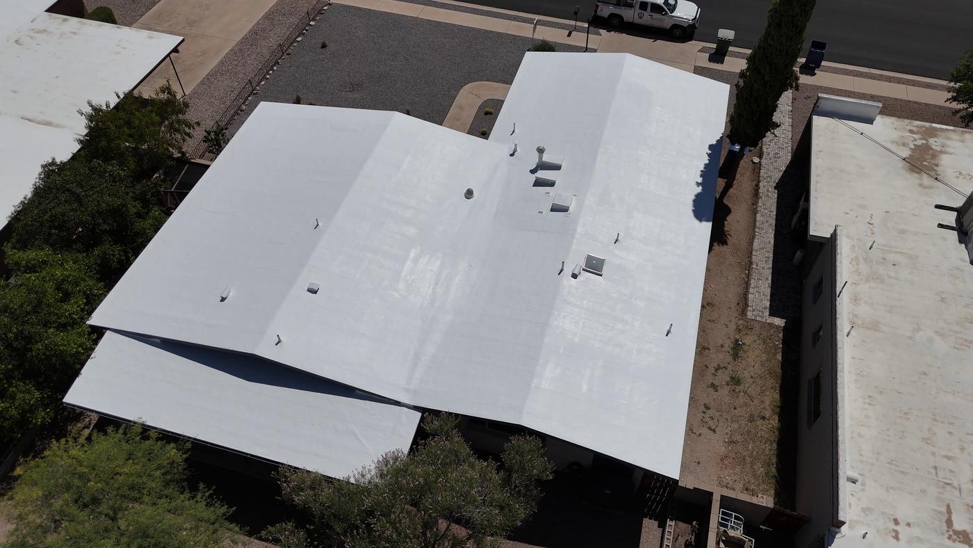 Aerial view of a finished roof coating project.