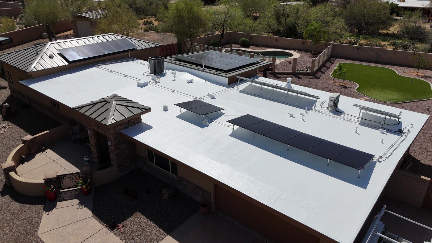 Aerial view of a finished roof coating project.