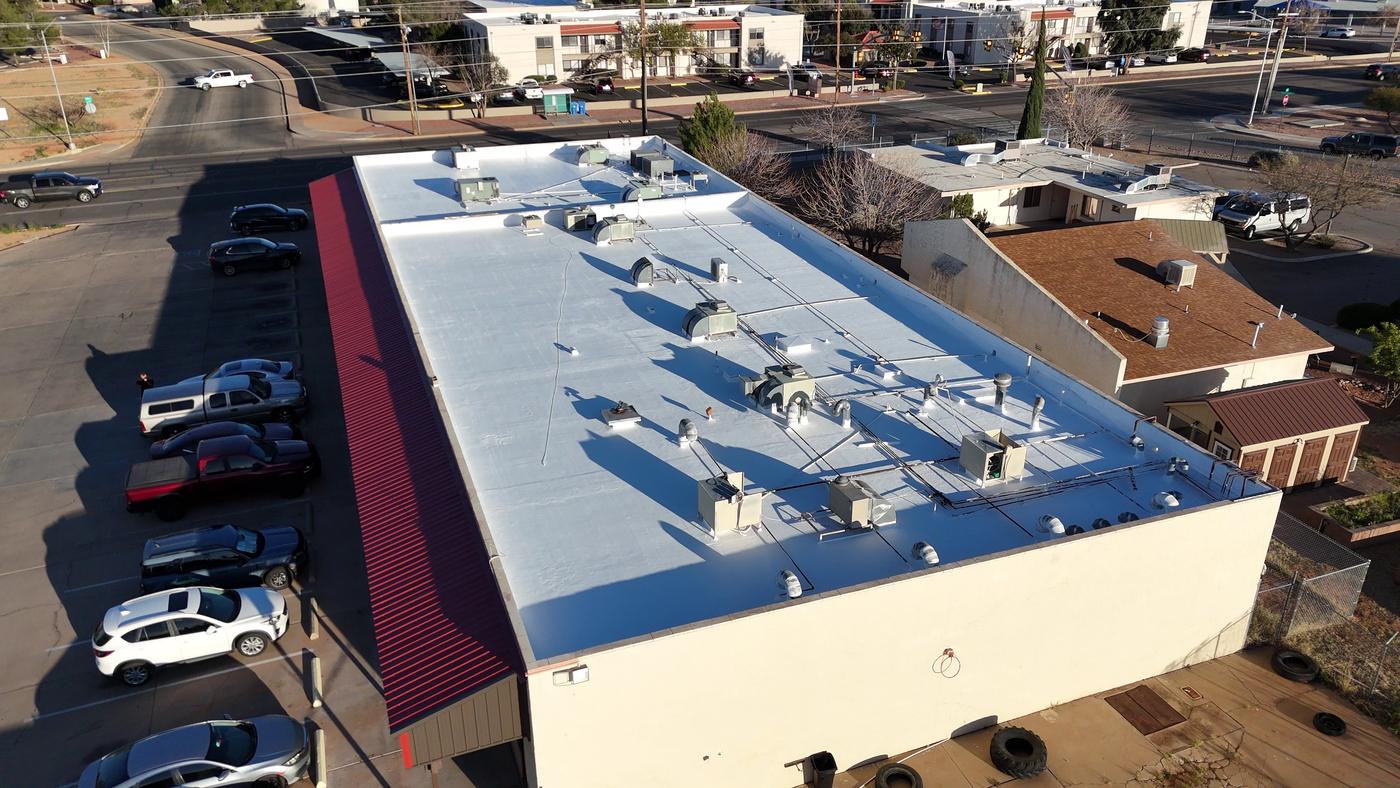 Finished roof coating on a commercial building.