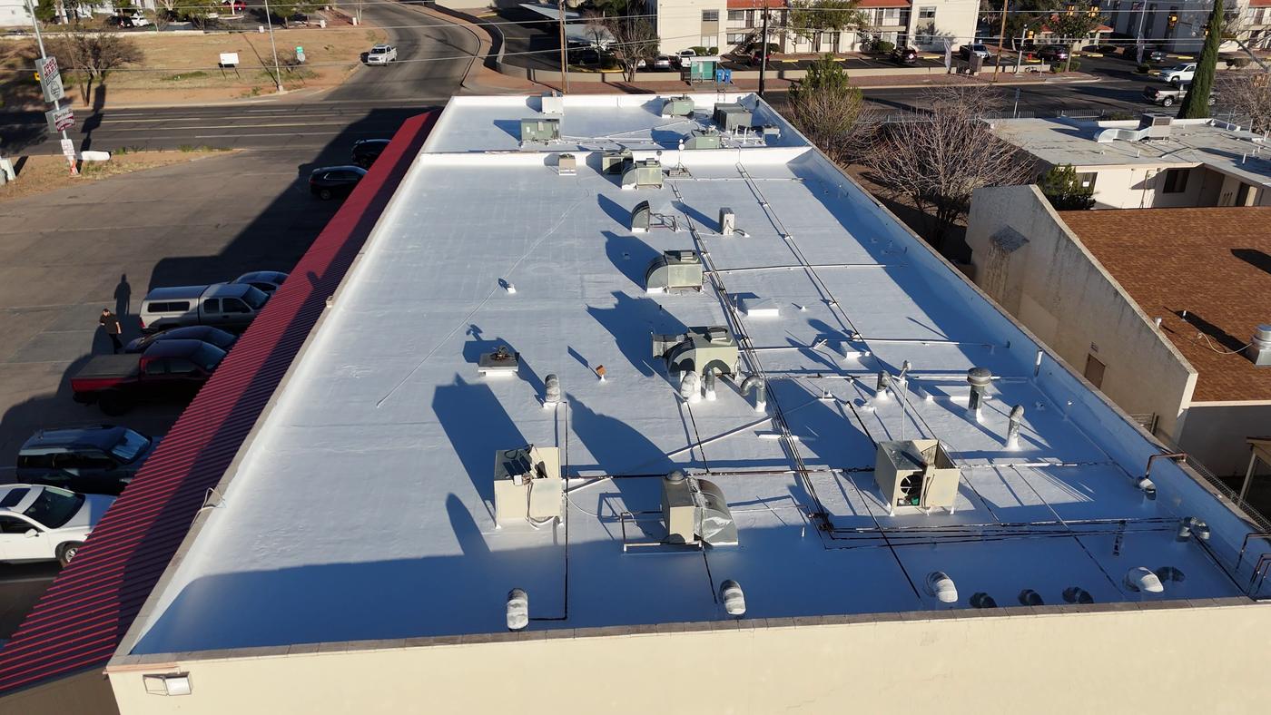 Finished roof coating on a commercial building.