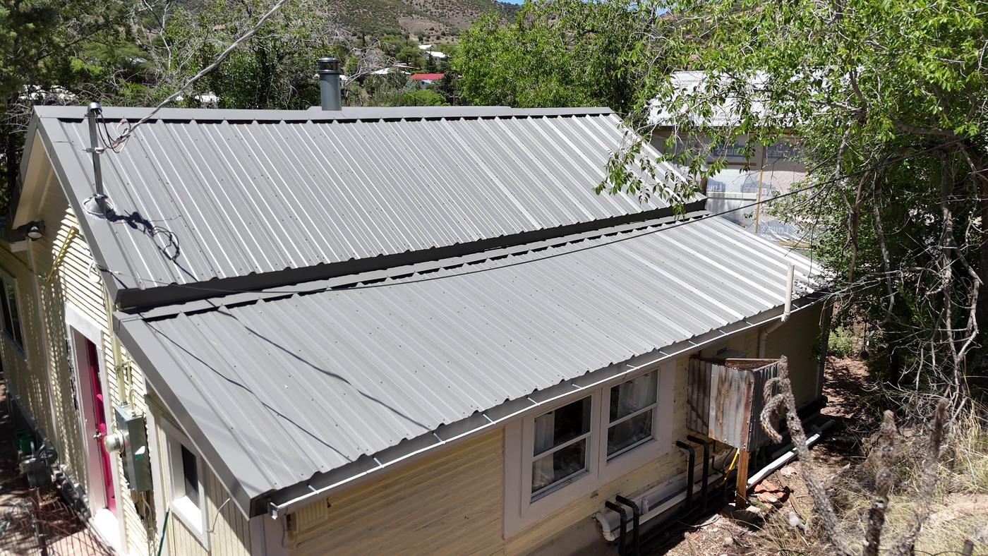 Aerial view of an exposed-fastener metal roof.