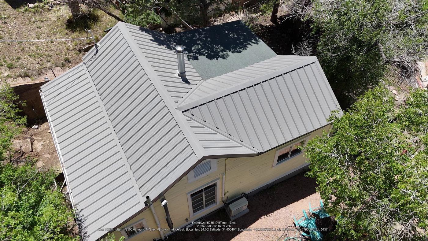 Aerial view of an exposed-fastener metal roof.