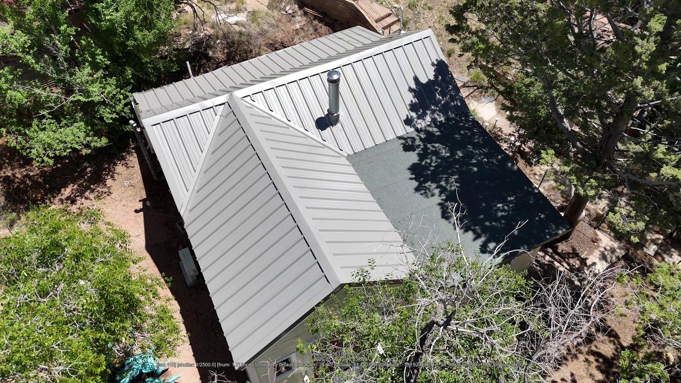 Aerial view of an exposed-fastener metal roof.