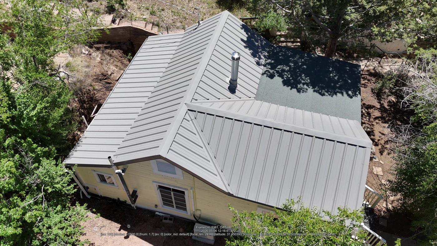 Aerial view of an exposed-fastener metal roof.