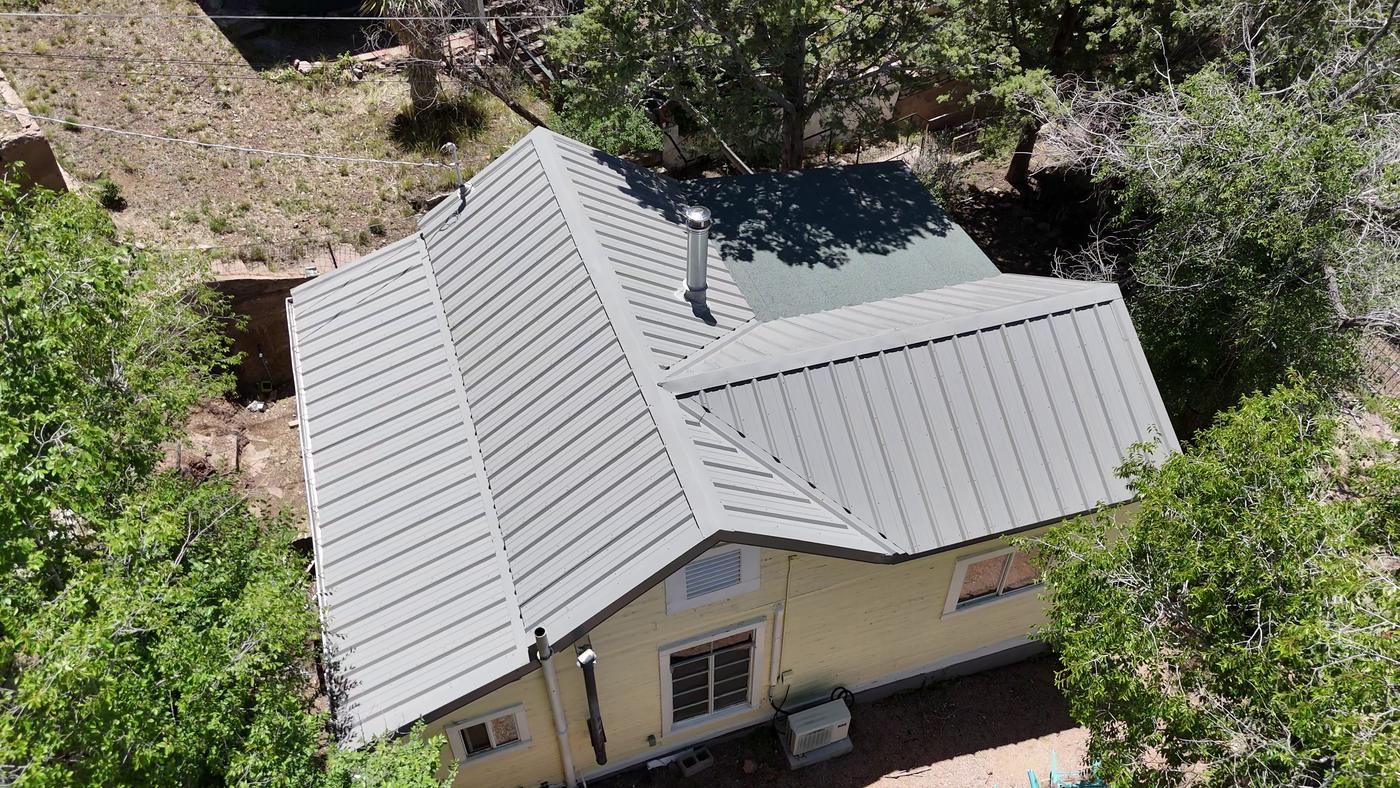Aerial view of an exposed-fastener metal roof.