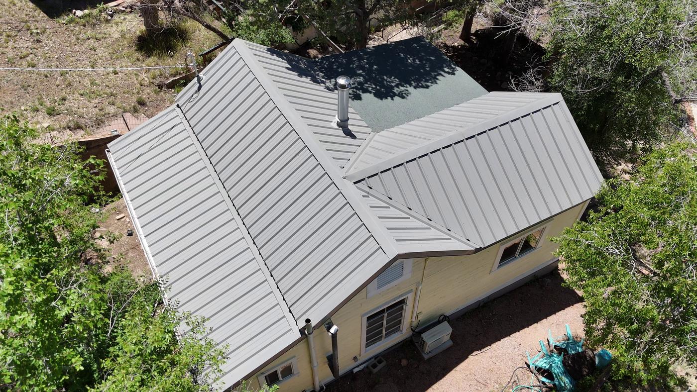Aerial view of an exposed-fastener metal roof.