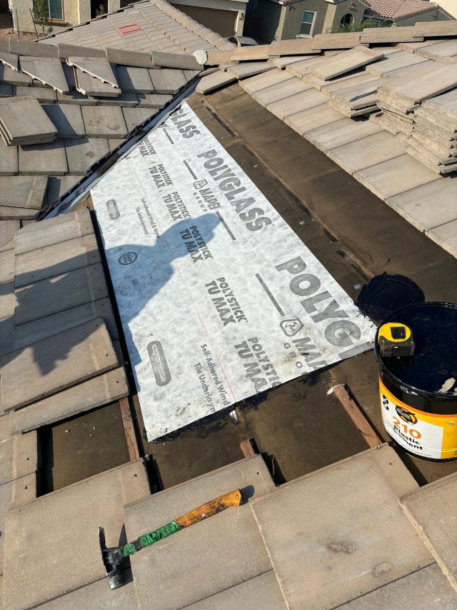 New Polyglass self-adhered tile underlayment being installed over the roof deck