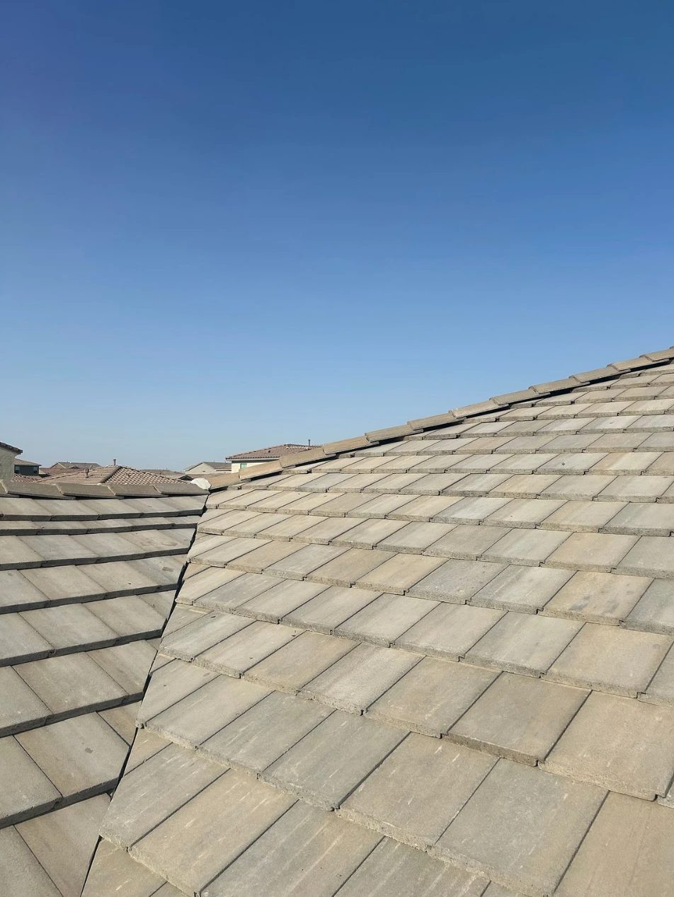 Concrete tile reset over the newly installed underlayment on a Tucson roof