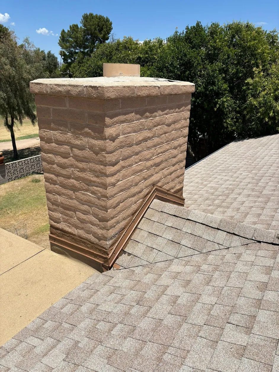The same chimney after SolTerra fitted stepped metal flashing along the roof line