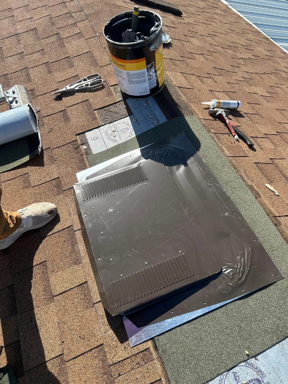 New vent flashing set into the shingle course during a SolTerra ventilation repair