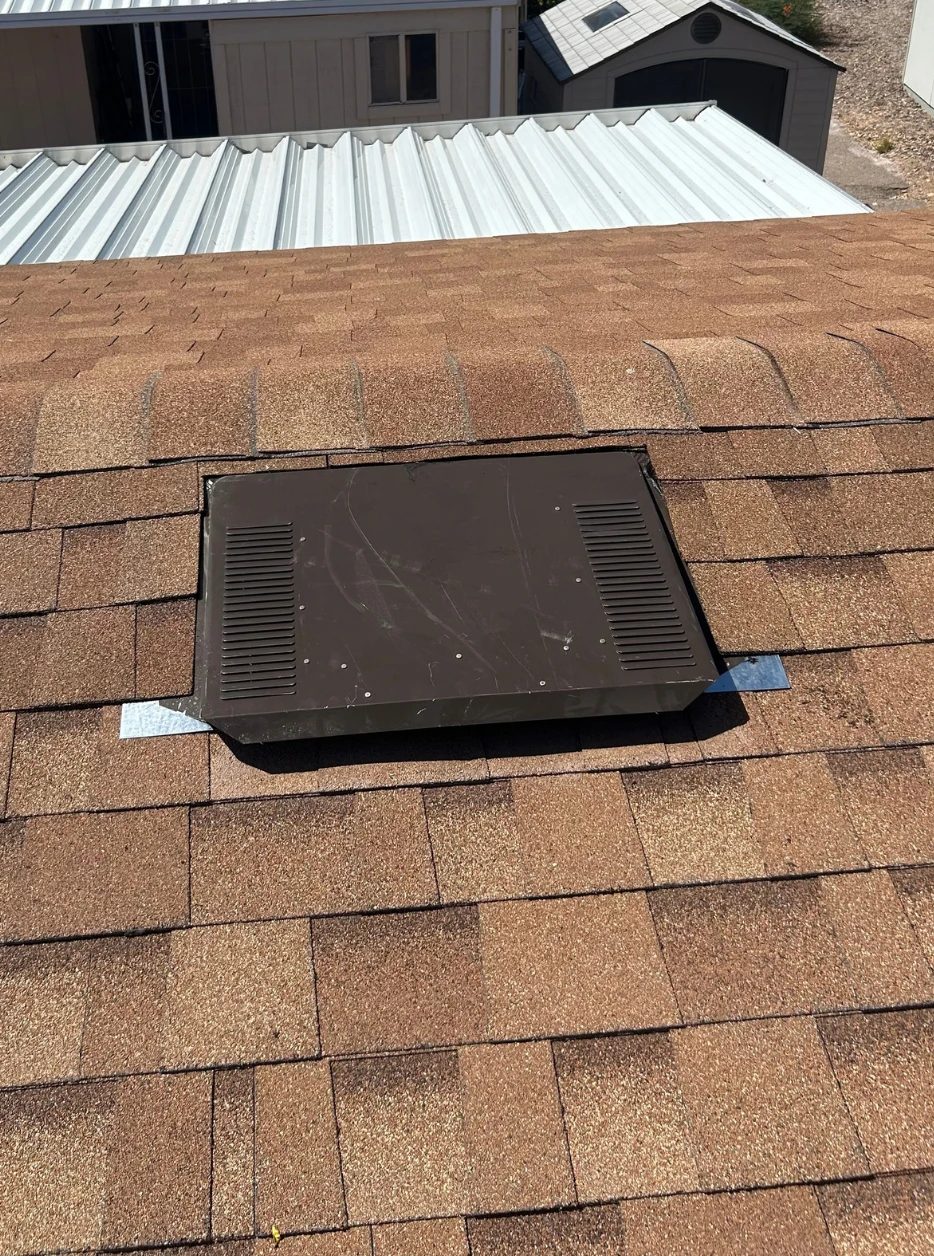Completed roof vent installed and sealed into the surrounding shingles