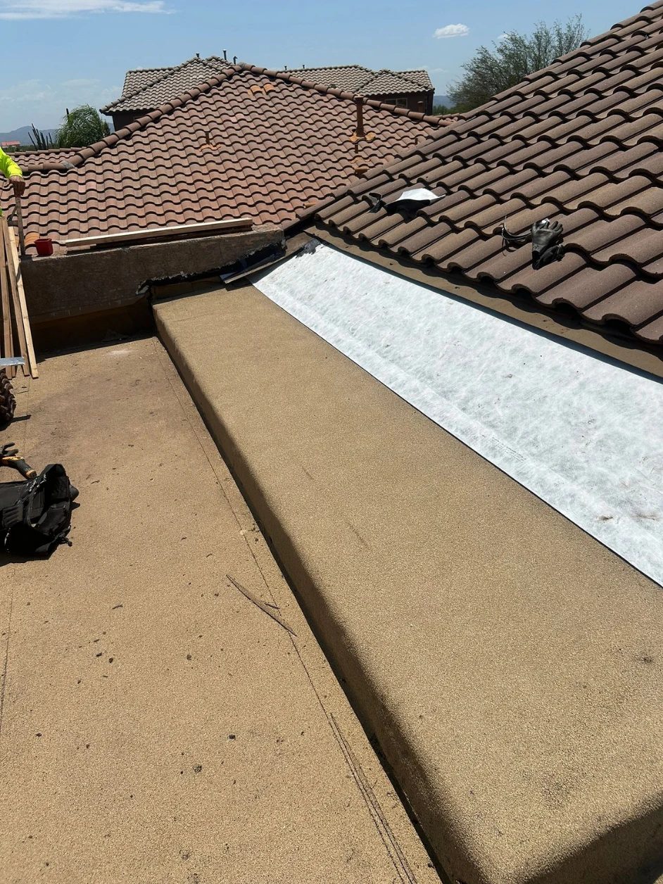 The rebuilt transition with new underlayment running up beneath the tile