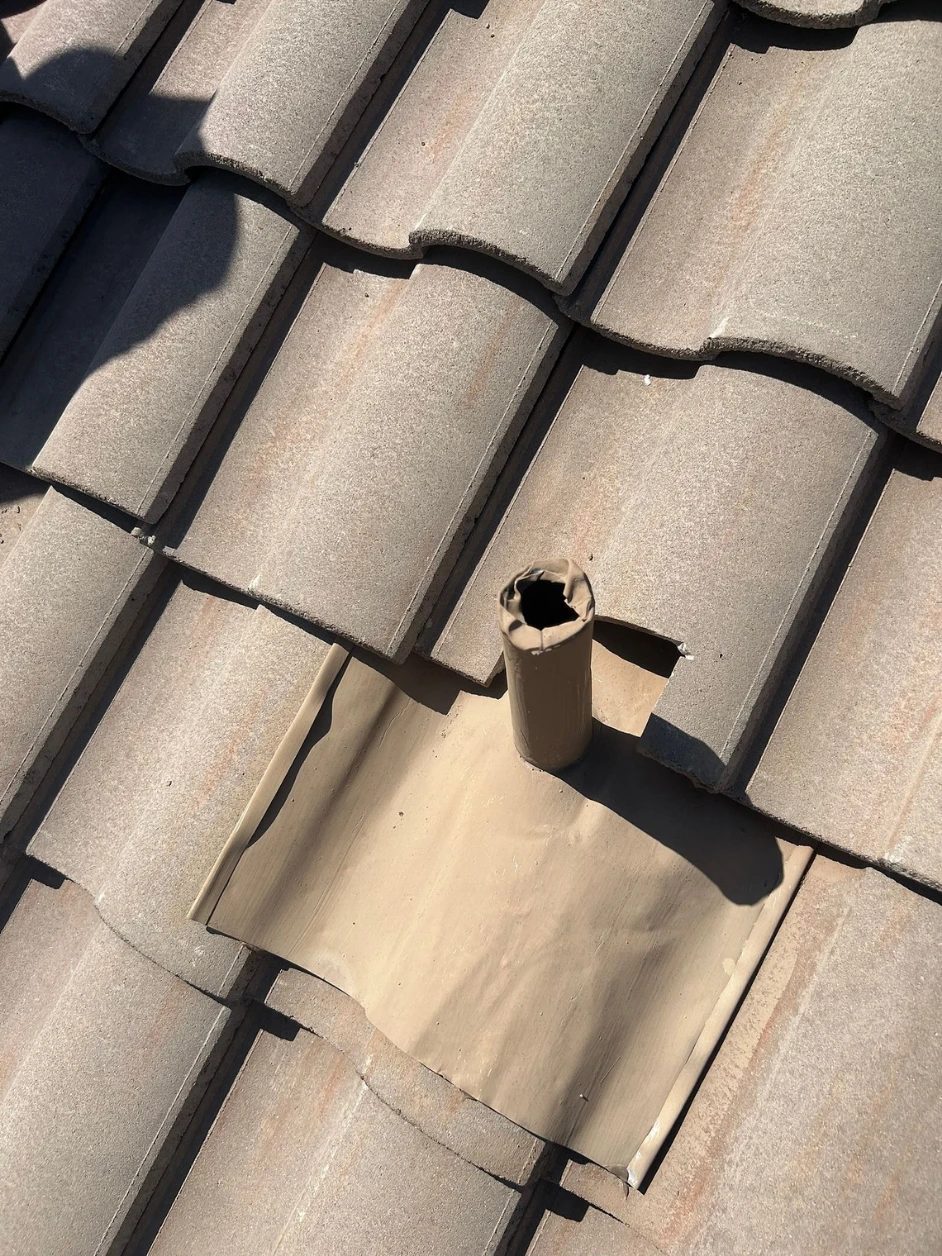 The same plumbing stack after SolTerra fitted a new flashing pan and reset the tile