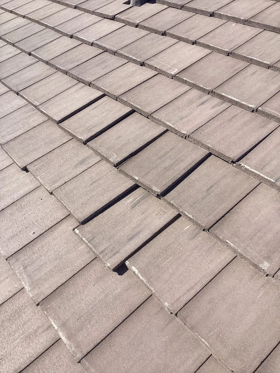 Concrete tiles slipped out of line on a Tucson roof