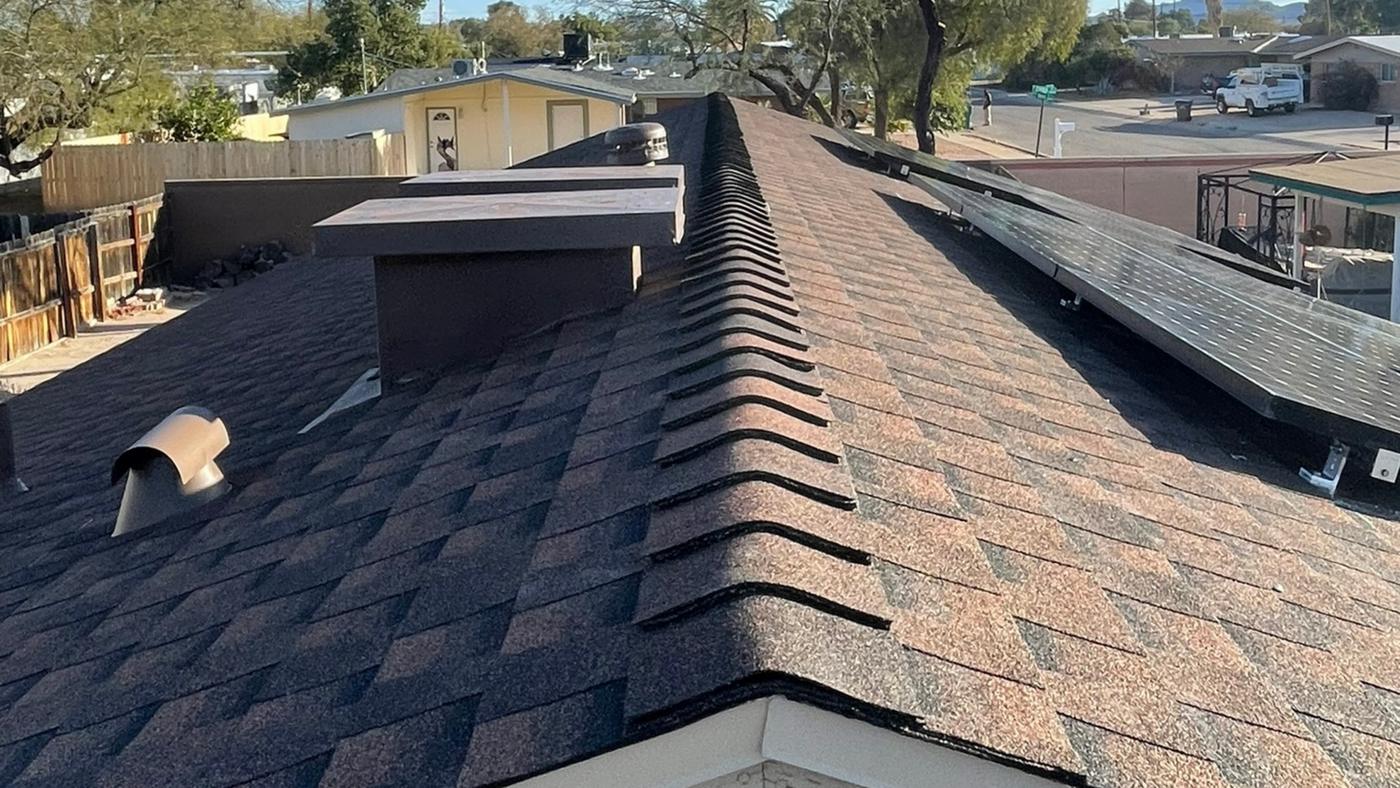 Finished GAF Hickory shingle roof with solar panels reinstalled.