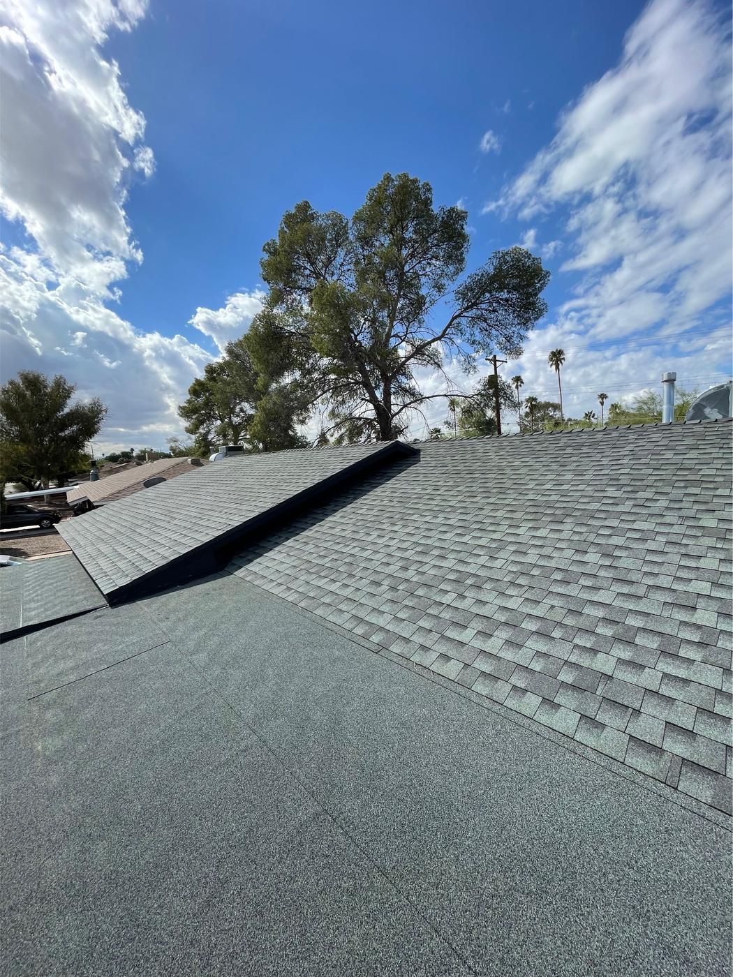 GAF shingle roof transitioning to a low-slope modified bitumen roof.