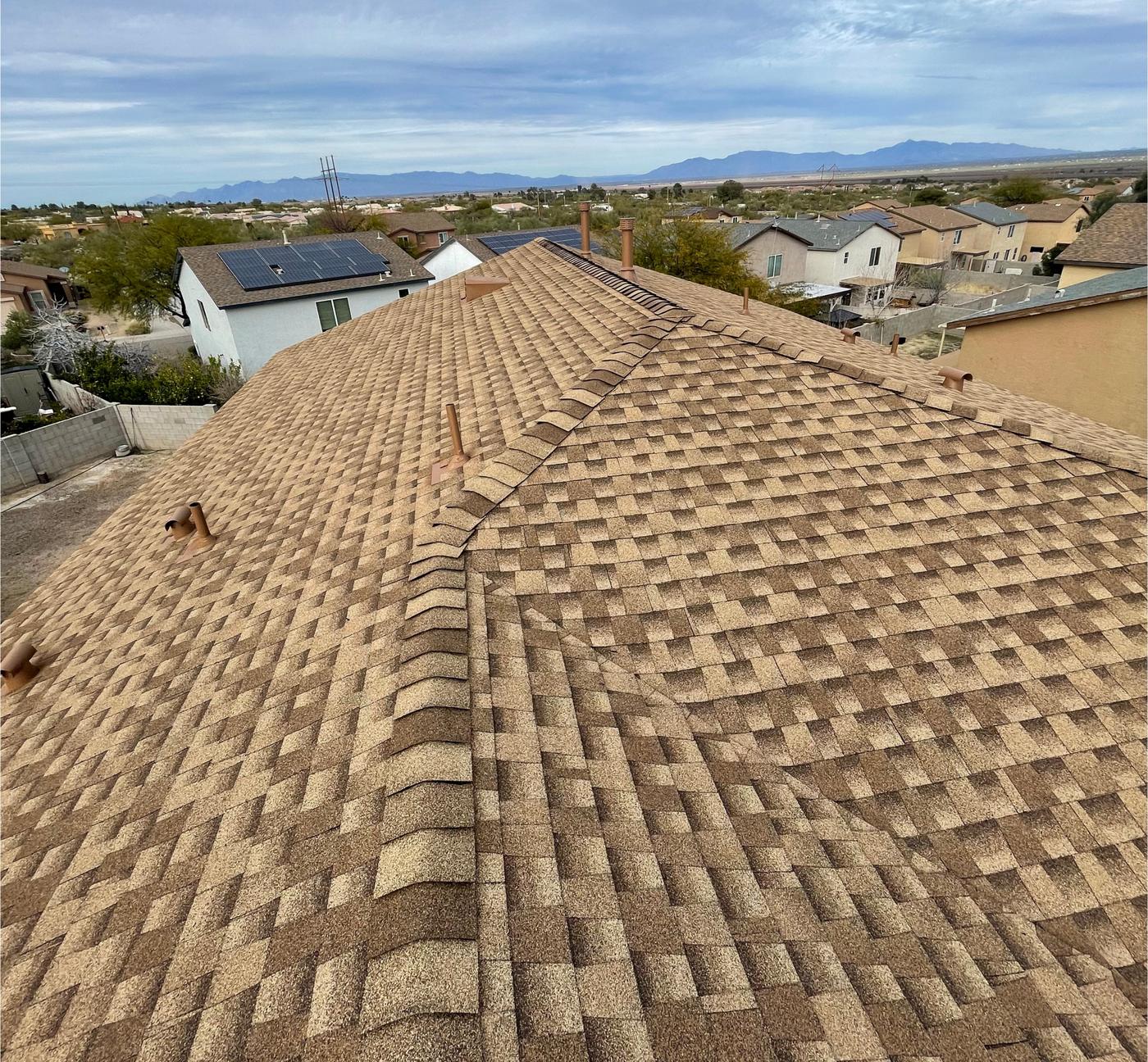 Finished Shakewood shingle roof with matching ridge caps.