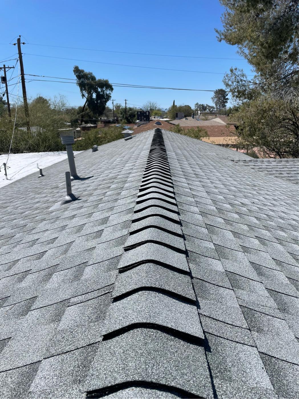 GAF Z-Ridge ridge caps on a Pewter Gray shingle roof.