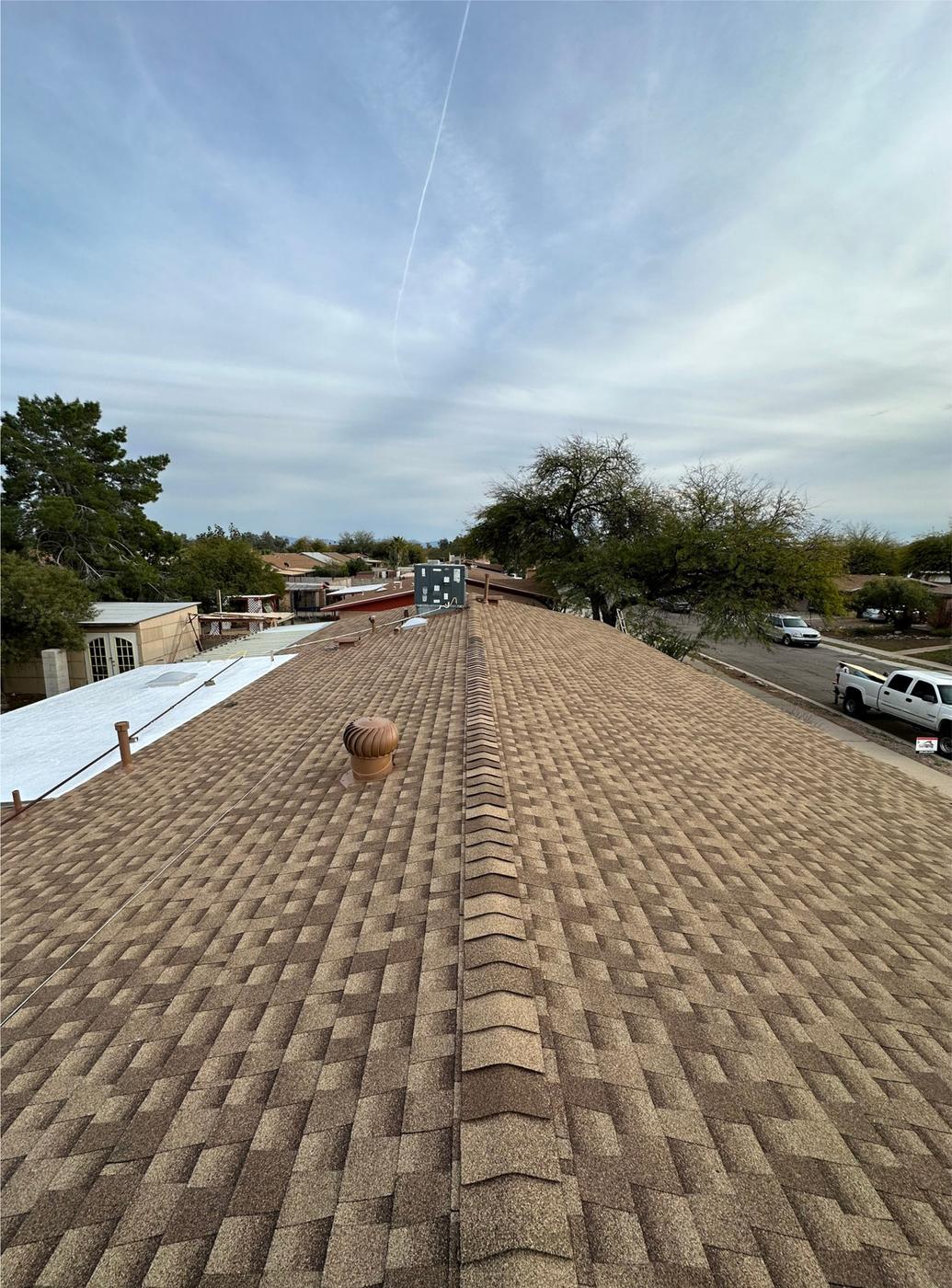 Finished Shakewood shingle roof with matching ridge caps.