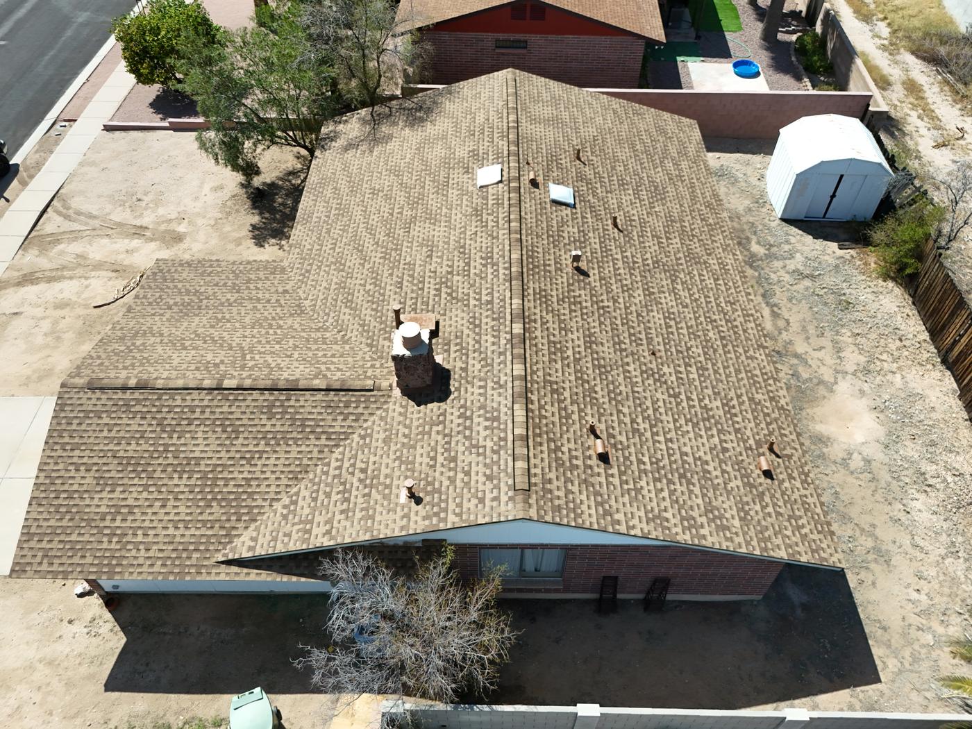 Aerial view of a finished asphalt shingle roof.