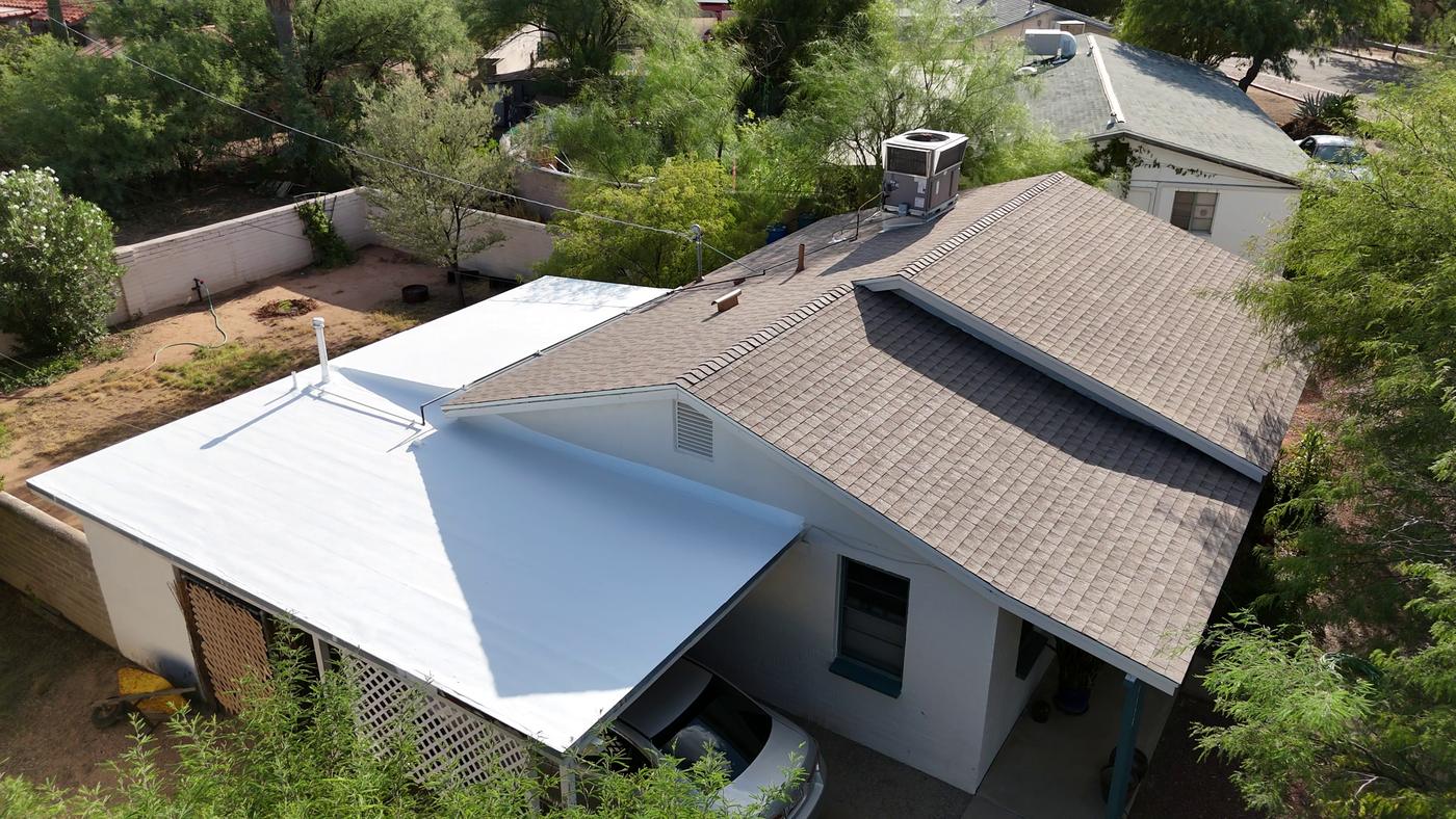 Aerial view of a finished Shakewood shingle roof and a freshly coated flat roof.