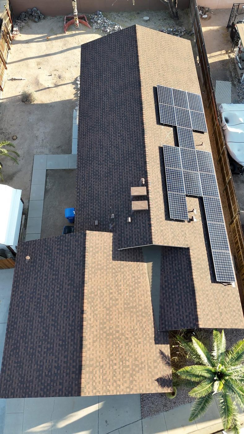 Overhead view of a finished Barkwood shingle roof with solar panels reinstalled.