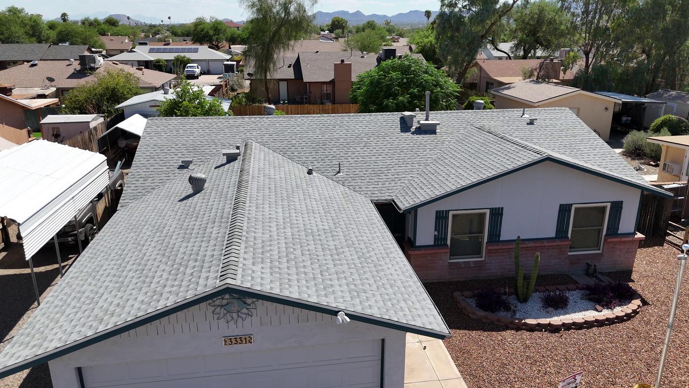 Aerial view of a finished asphalt shingle roof.