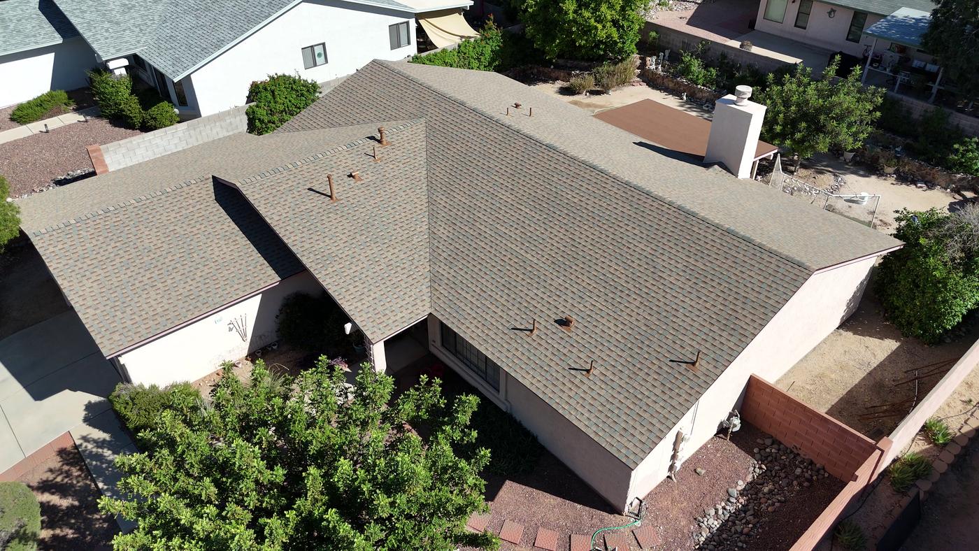 Aerial view of a finished asphalt shingle roof.