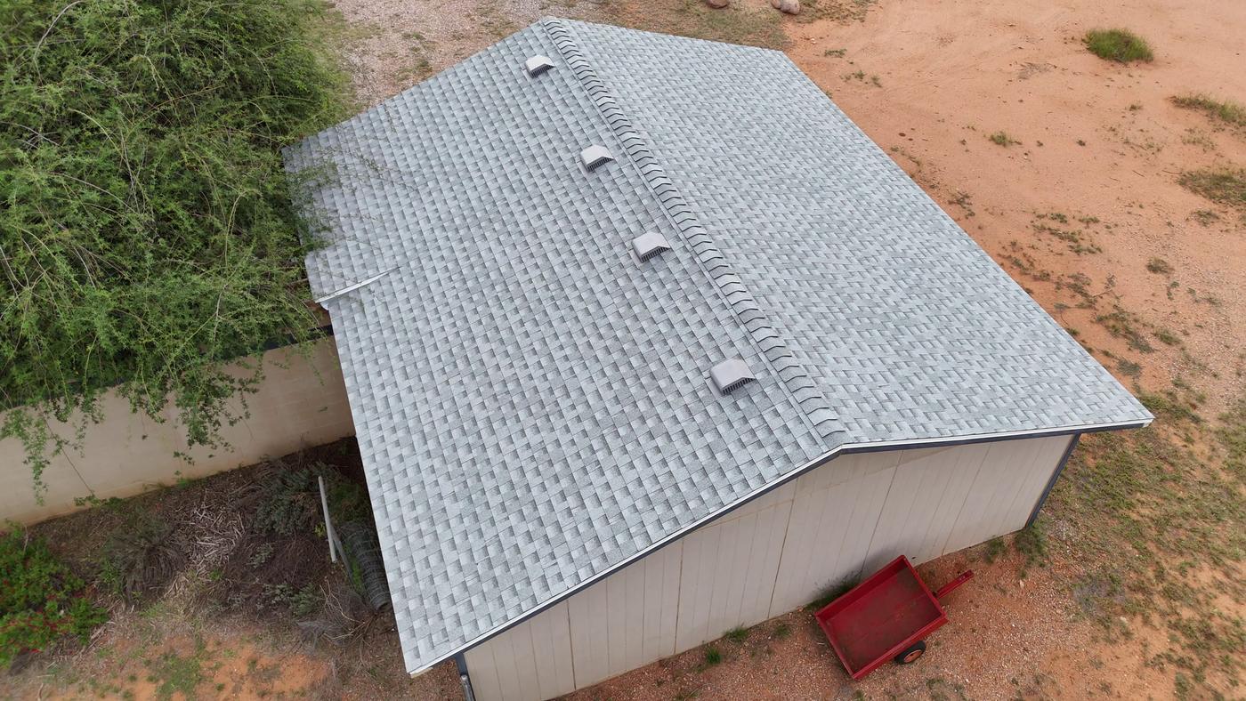 Finished asphalt shingle roof on a detached garage.