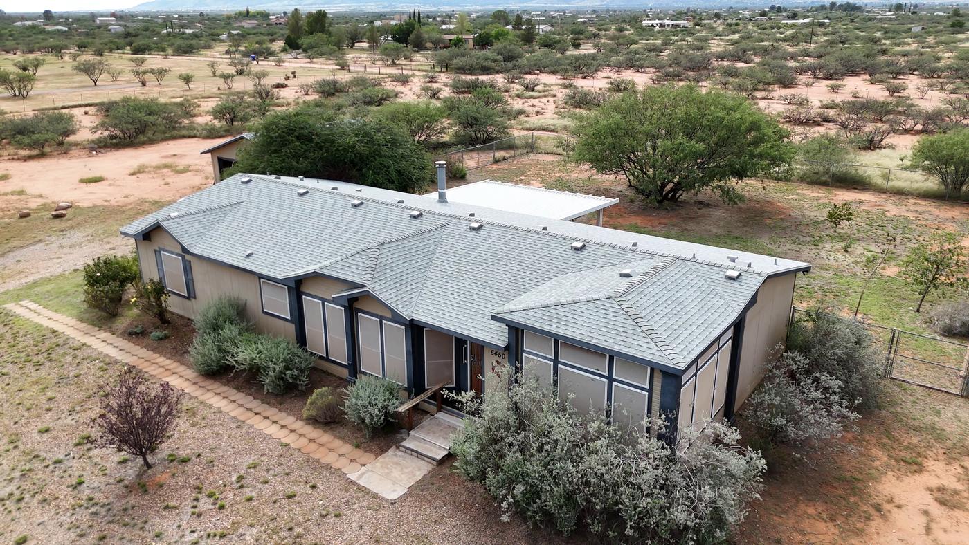 Aerial view of a finished asphalt shingle roof.