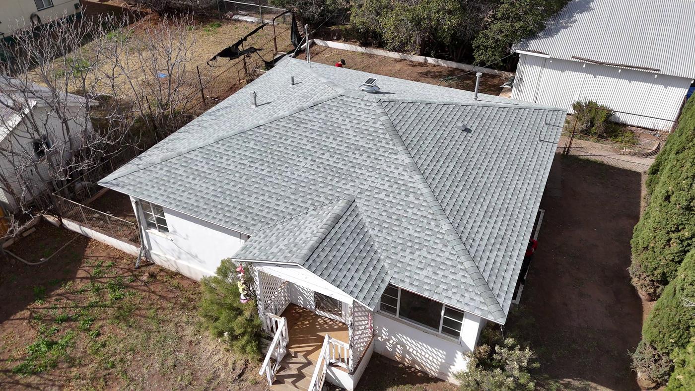 Aerial view of a finished asphalt shingle roof.