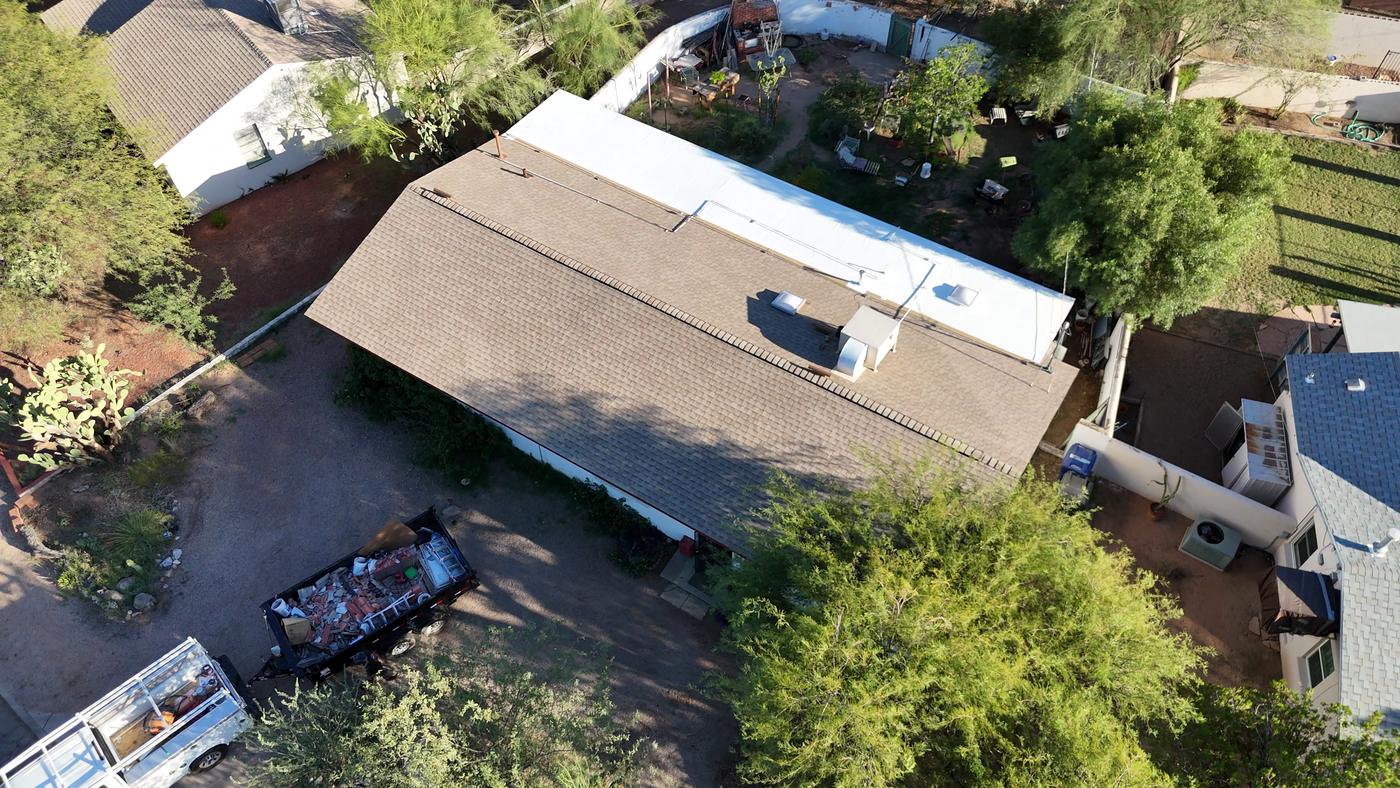 Aerial view of a finished asphalt shingle roof.