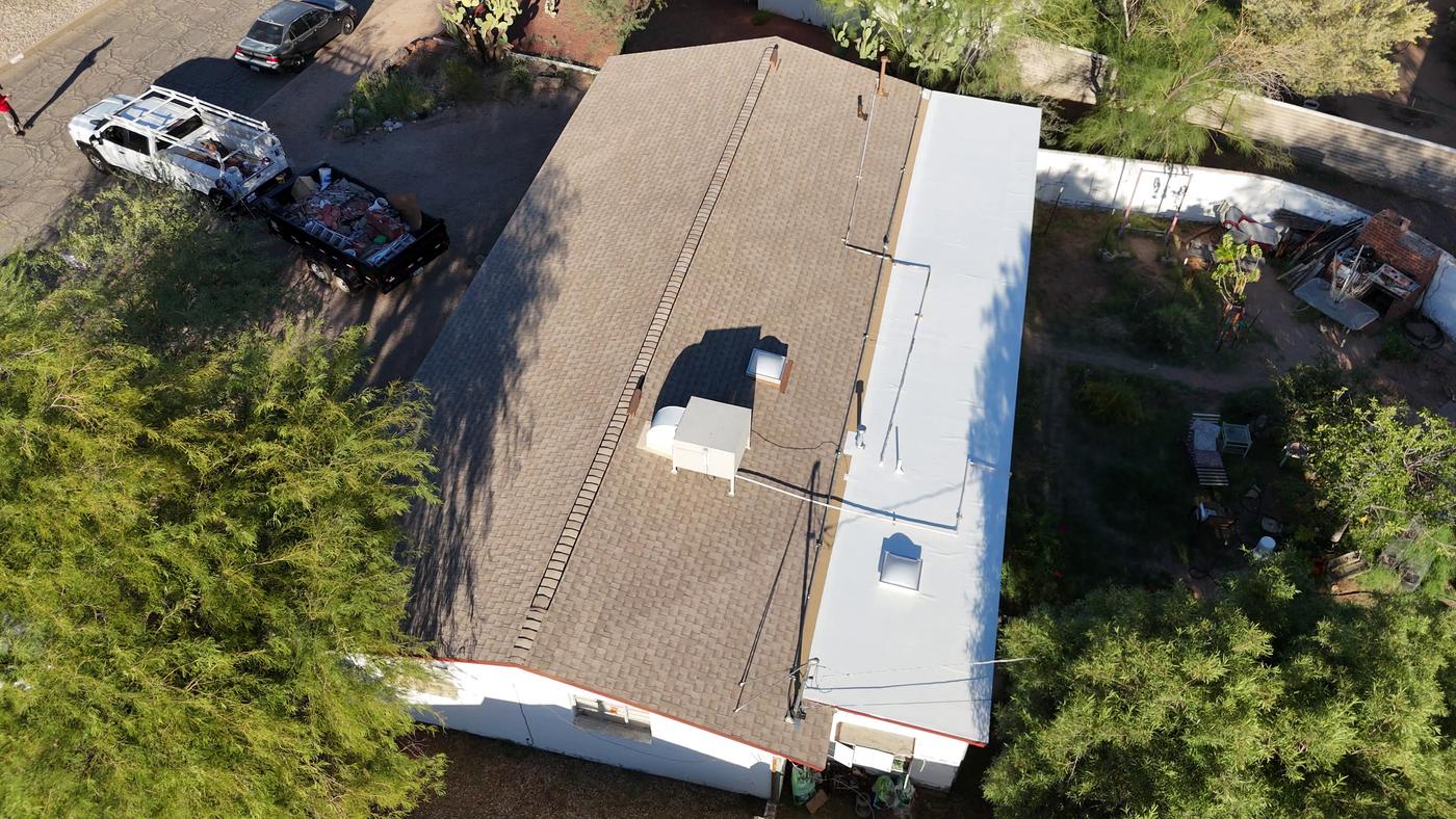 Overhead view of a finished asphalt shingle roof.