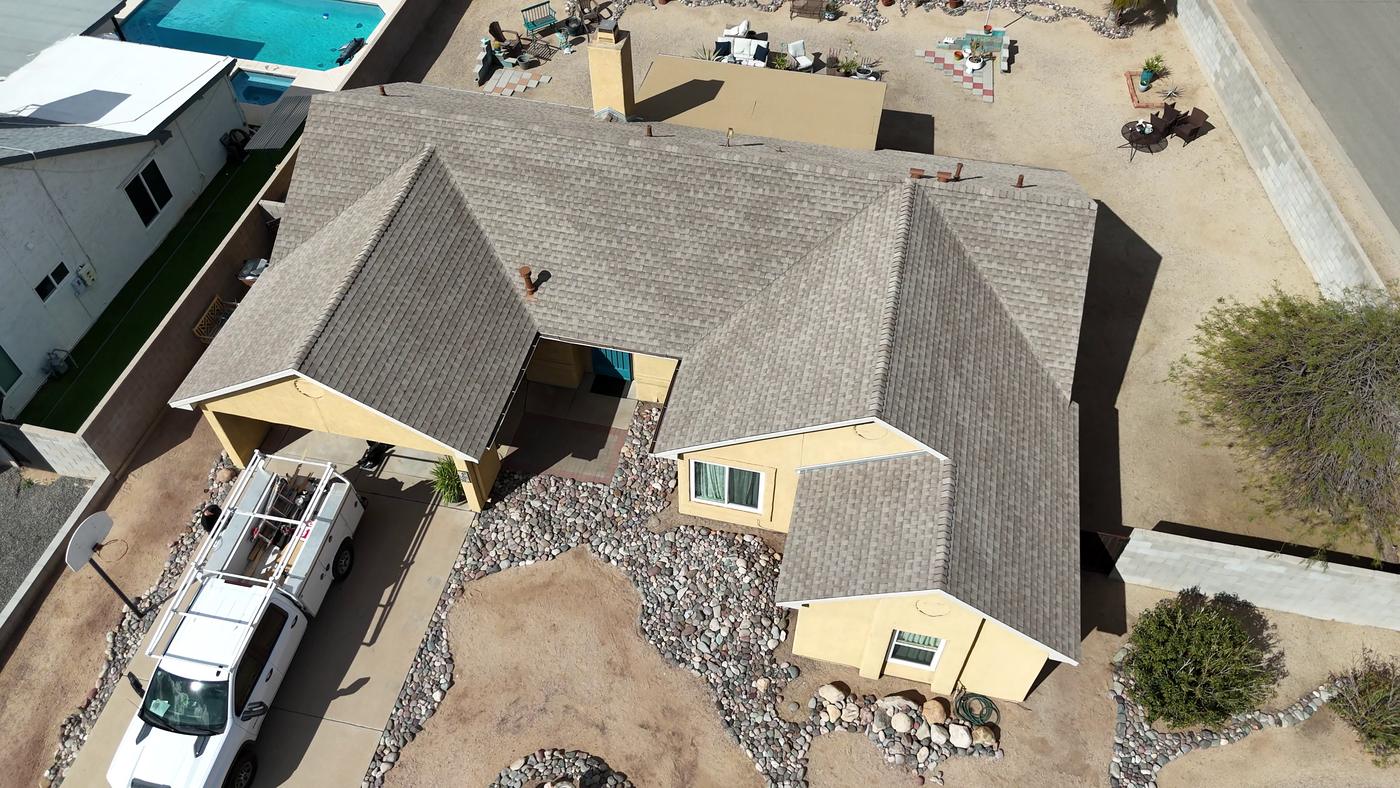 Aerial view of a finished asphalt shingle roof.