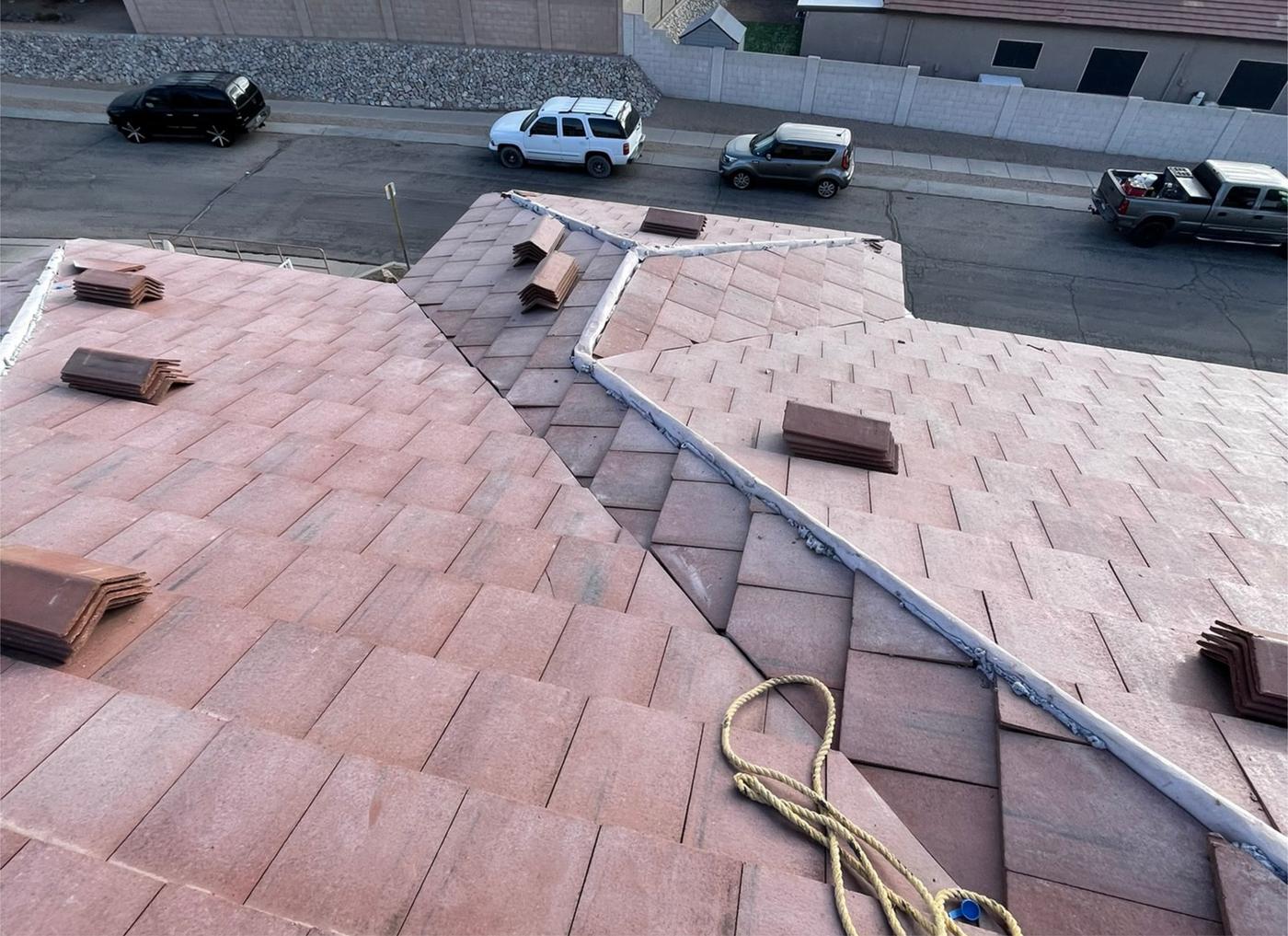 Concrete tile roof before ridge cap installation.