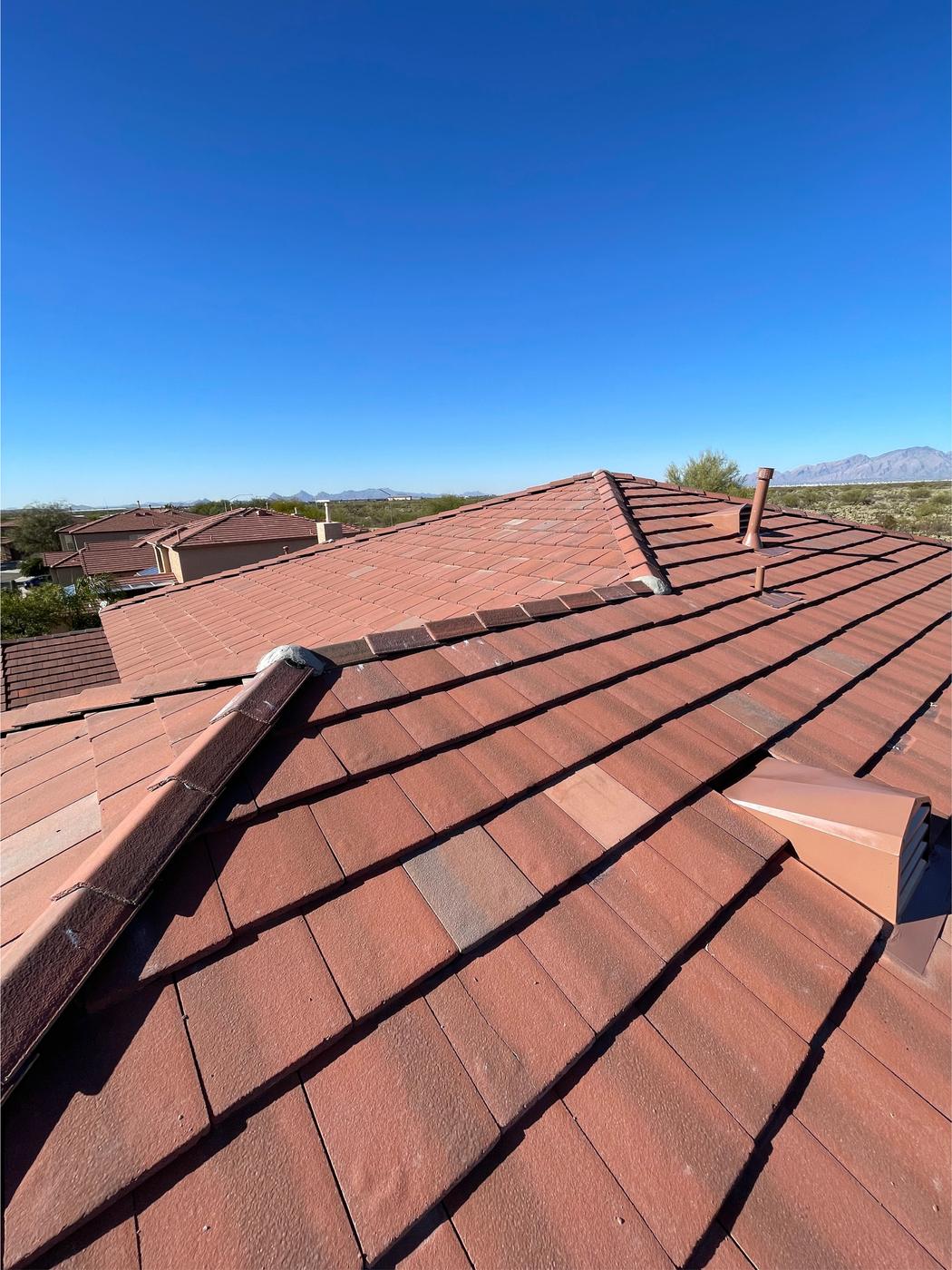 Finished roof with flat-profile concrete tiles.