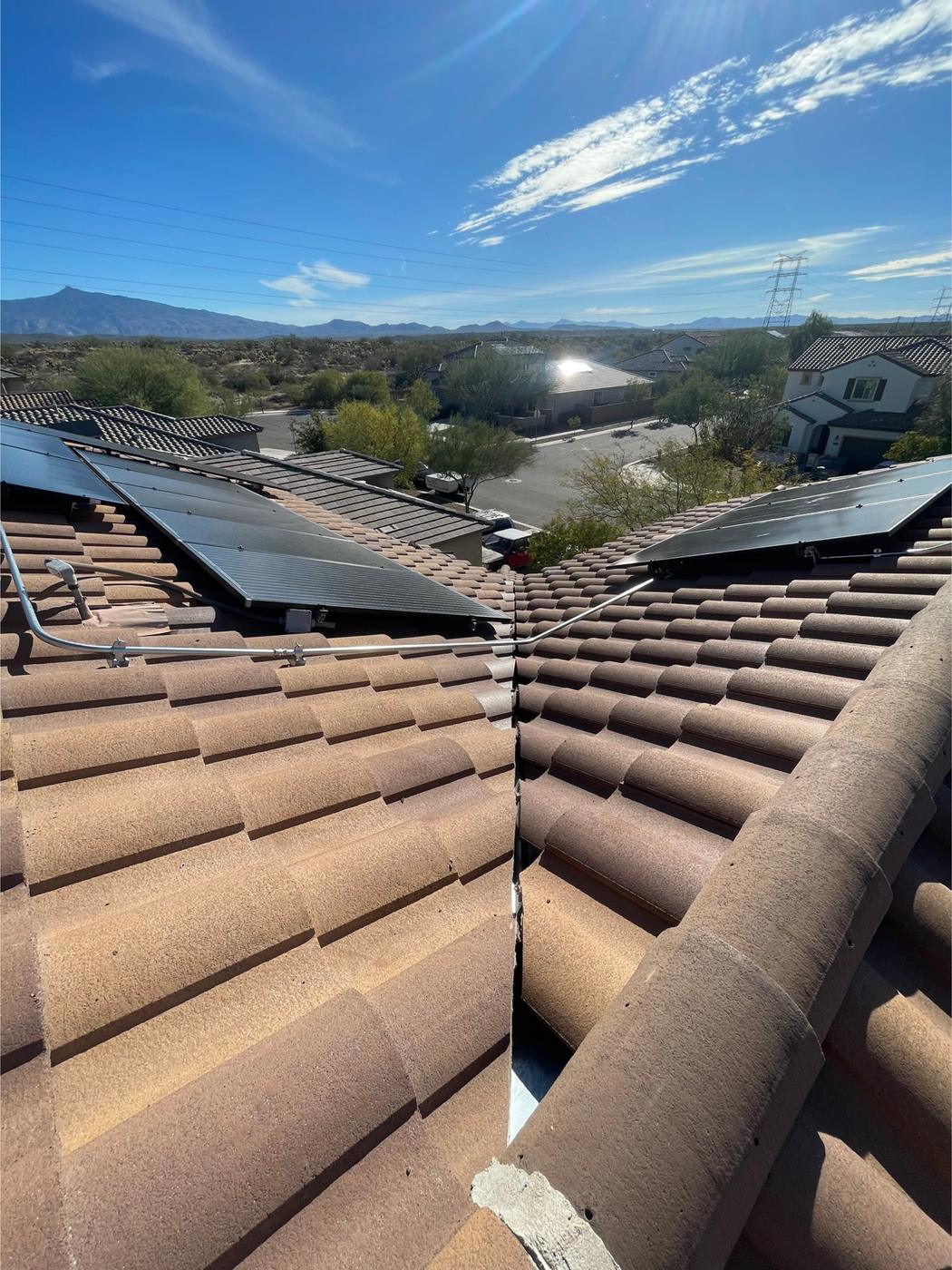 Finished S-type tile roof with solar panels reinstalled.