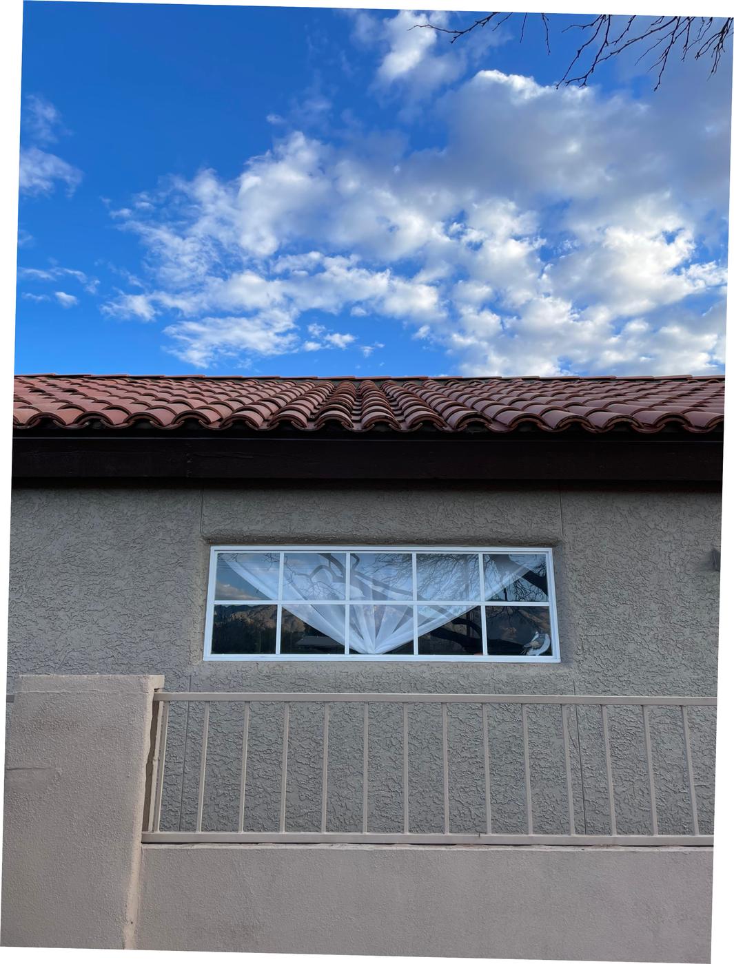 Two-piece clay tile roof.
