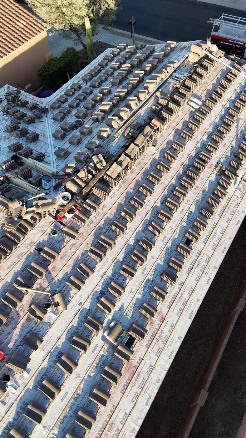 Concrete tile roof installation in progress.
