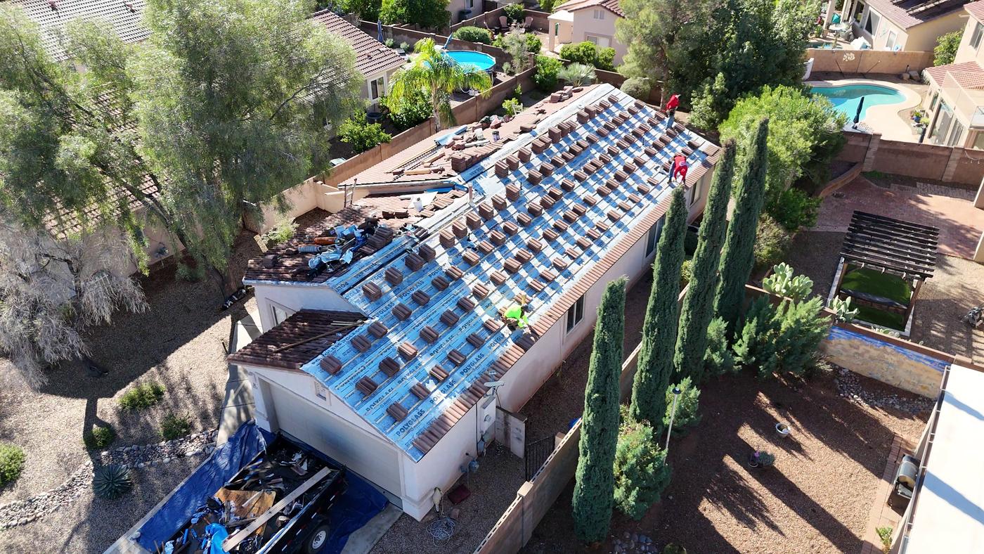 Aerial view of a W-type tile roof replacement in progress.