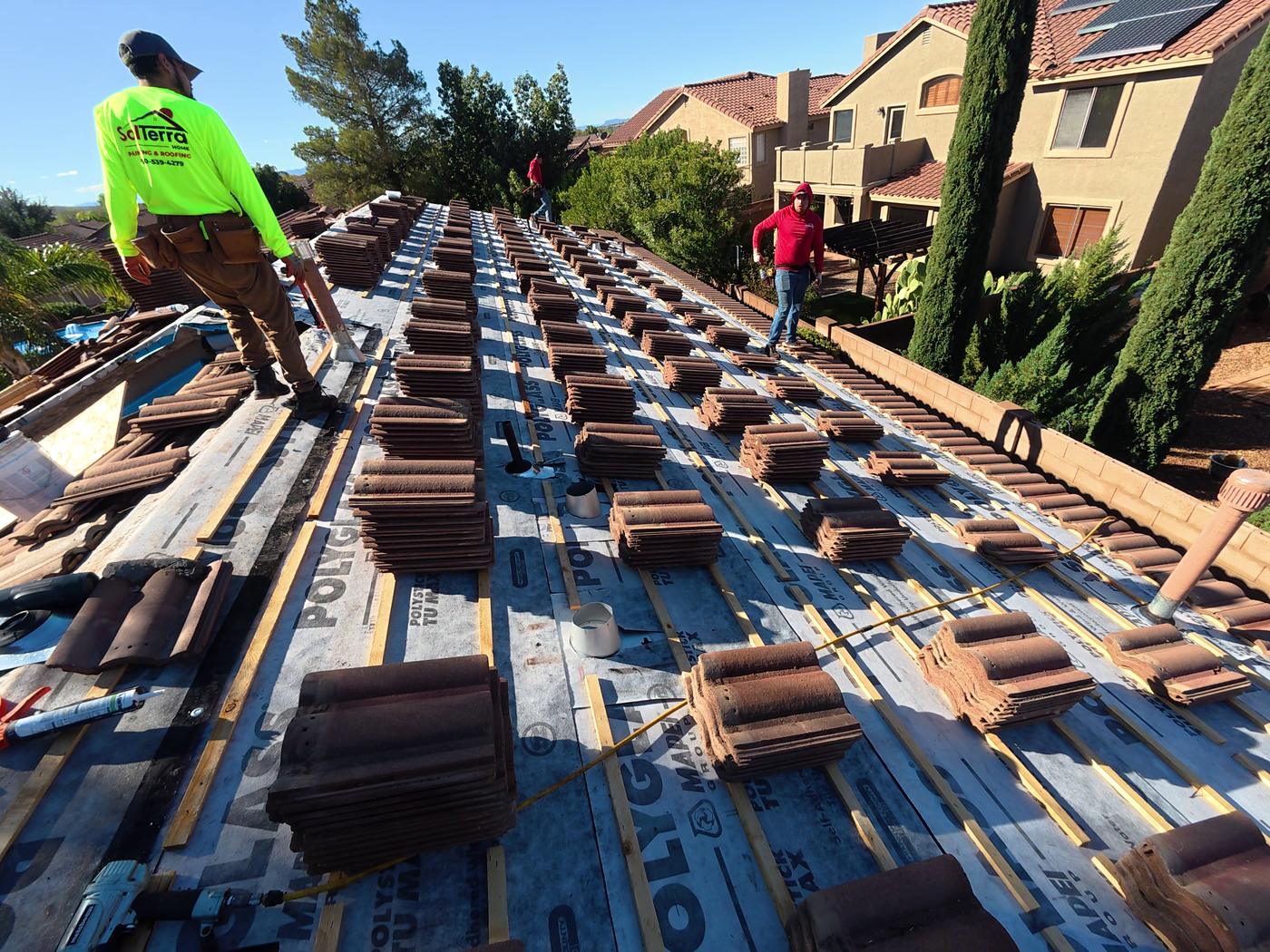 W-type tile roof replacement in progress.