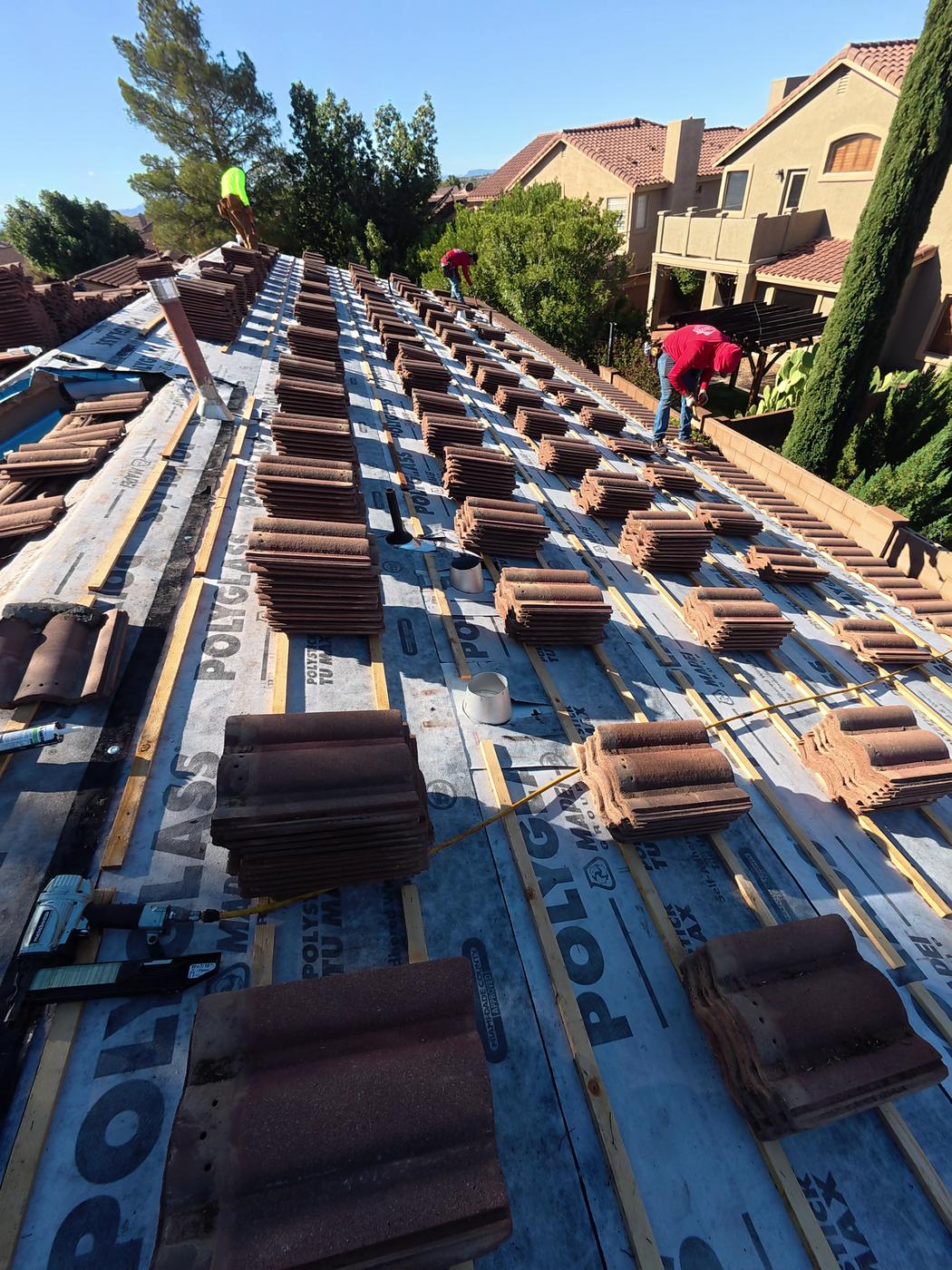 W-type tile roof replacement in progress.