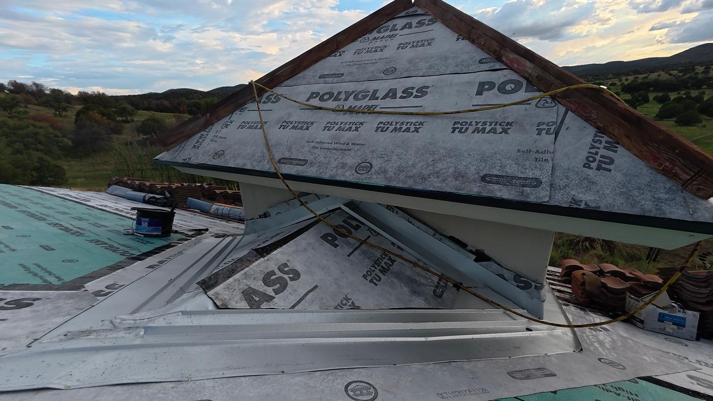Custom roof flashing around a bell tower.