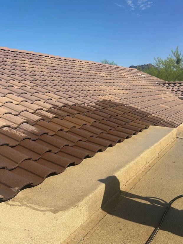 Finished tile meeting the coated flat roof, water tested along the transition