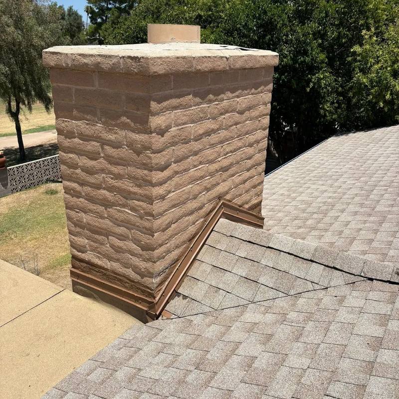 The same chimney after SolTerra fitted stepped metal flashing along the roof line